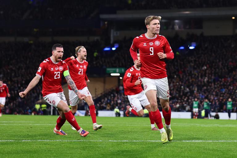 GLASGOW, SCOTLAND - NOVEMBER 18:  Rasmus Hojlund of Denmark celebrates after scoring a goal to make it 1-1 during the FIFA World Cup 2026 qualifier match between Scotland and Denmark at Hampden Park on November 18, 2025 in Glasgow, Scotland. (Photo by Robbie Jay Barratt - AMA/Getty Images)