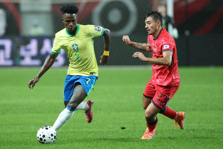 SEOUL, SOUTH KOREA - OCTOBER 10: Vinicius Junior of Brazil (L) controls the ball against Jens Castrop of South Korea (R) during the international friendly between South Korea and Brazil at Seoul World Cup Stadium on October 10, 2025 in Seoul, South Korea. (Photo by Chung Sung-Jun/Getty Images)