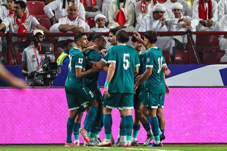 Iraq's players celebrate their first goal during the FIFA World Cup 2026 Asian qualifier football match between the United Arab Emirates and Iraq at the Mohammed bin Zayed Stadium in Abu Dhabi on November 13, 2025. (Photo by Fadel SENNA / AFP) (Photo by FADEL SENNA/AFP via Getty Images)          